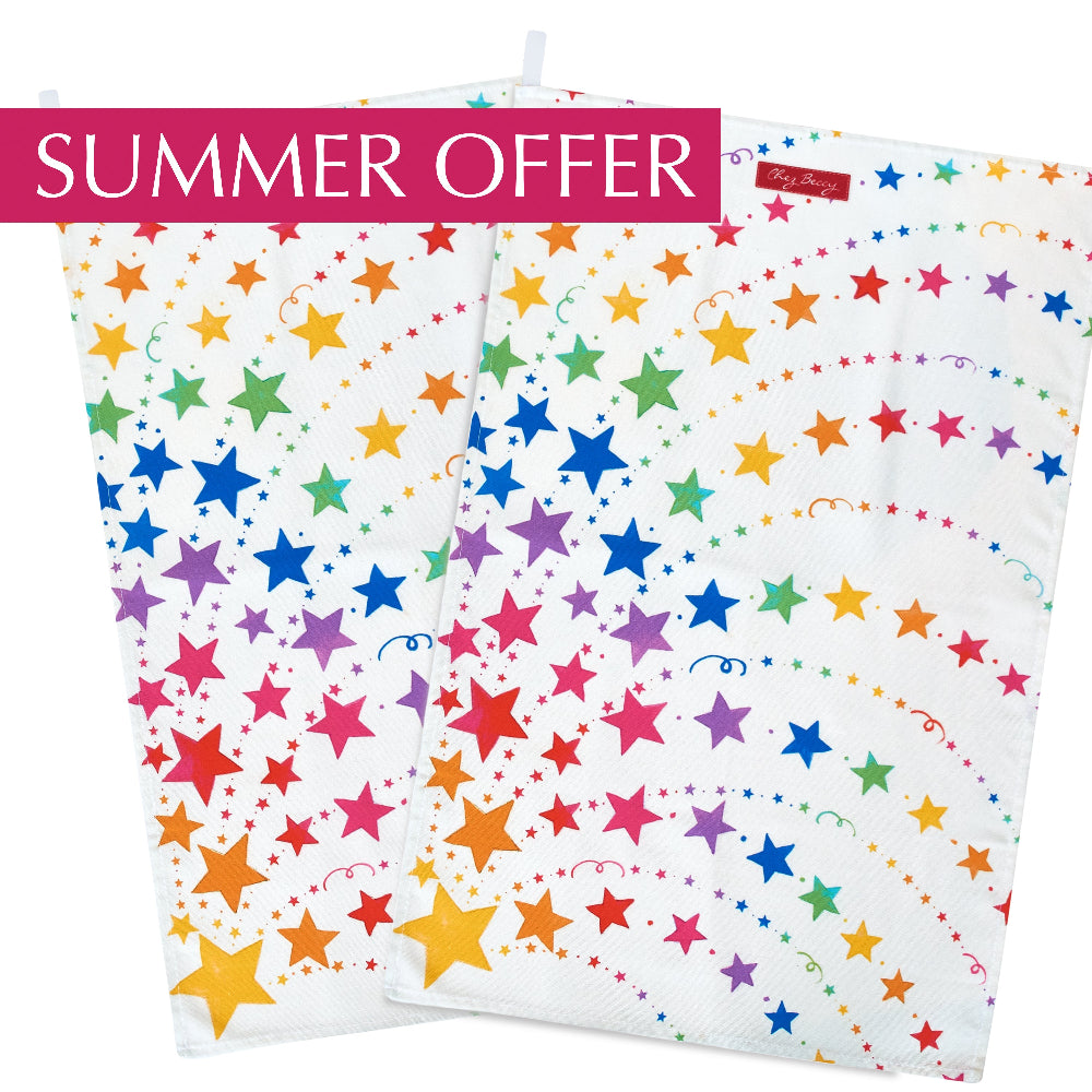 Summer Offer: Set of @. A 100% cotton tea towel featuring a vibrant spray of multicoloured stars, adding a cheerful touch to any kitchen. Measuring approximately 70cm x 47cm, it's both absorbent and stylish. Designed and made in the UK.