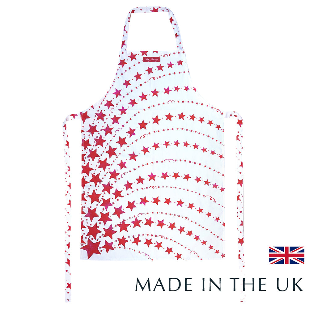 Red Shooting Stars Apron with hand-drawn shooting star design in bold red and white, made from 100% half panama cotton with front pocket and extra-long ties