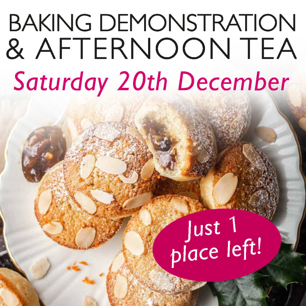 A promotional image for a baking demonstration and afternoon tea event on Saturday, 13th December. The image features delicious mince pies, topped with frangipane. The text is styled in a mix of elegant black and festive pink fonts. Just 1 place left