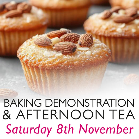 Baking Demonstration & Afternoon Tea – Saturday, 8th November. A close-up of golden almond-topped apple cakes, lightly dusted with icing sugar, set against a blurred background of additional bakes. This inviting image promotes a hands-on baking experience and afternoon tea event, perfect for food lovers and those seeking a unique culinary day out in Oxfordshire.