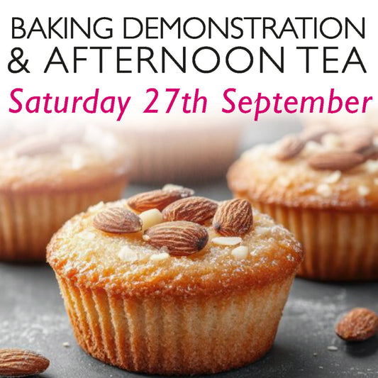 Baking Demonstration & Afternoon Tea – Saturday, 27th September. A close-up of golden almond-topped apple cakes, lightly dusted with icing sugar, set against a blurred background of additional bakes. This inviting image promotes a hands-on baking experience and afternoon tea event, perfect for food lovers and those seeking a unique culinary day out in Oxfordshire.