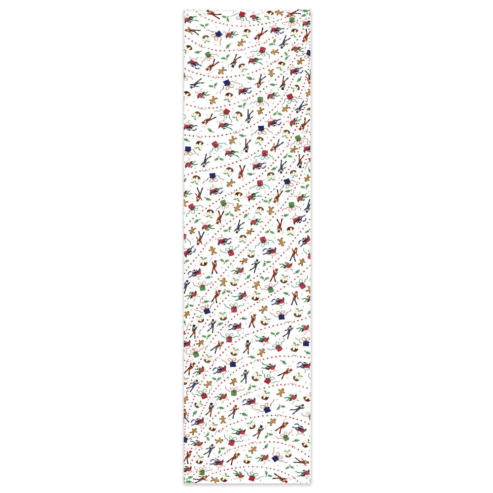 Exploding Christmas table runner with colourful festive illustrations including gingerbread men, baubles, candy canes, and presents on white background – Chez Beccy British design.
