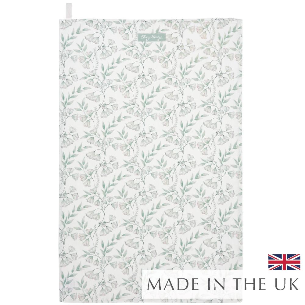 Sage green floral tea towel with an elegant clematis-inspired pattern, made from 100% cotton. Stylish, absorbent, and perfect for everyday kitchen use.