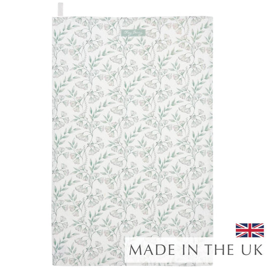 Sage green floral tea towel with an elegant clematis-inspired pattern, made from 100% cotton. Stylish, absorbent, and perfect for everyday kitchen use.