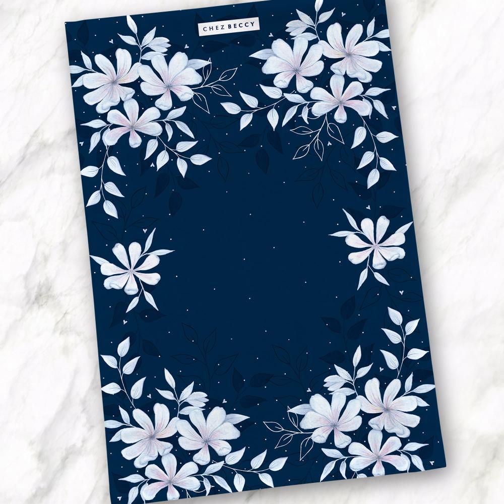 Luxury Navy Magnolia Floral Tea Towel made from 100% half panama cotton, featuring a hand-painted Magnolia-inspired design. Highly absorbent and perfect for drying dishes and glassware. Made in the UK.