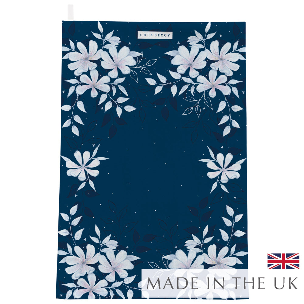 Luxury Navy Magnolia Floral Tea Towel made from 100% half panama cotton, featuring a hand-painted Magnolia-inspired design. Highly absorbent and perfect for drying dishes and glassware. Made in the UK.