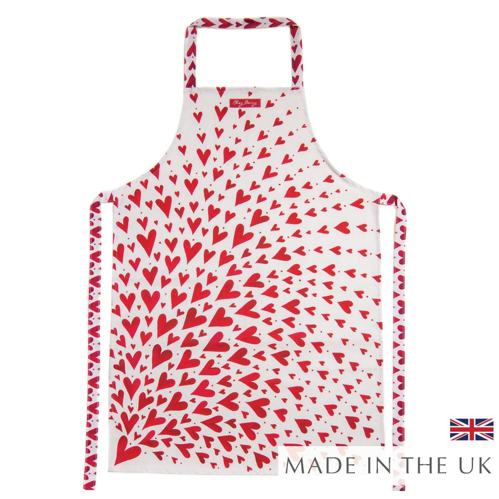 Red Shooting Heart Apron – Vibrant cotton apron with hand-drawn shooting heart design, perfect for baking, cooking, or hosting in the kitchen