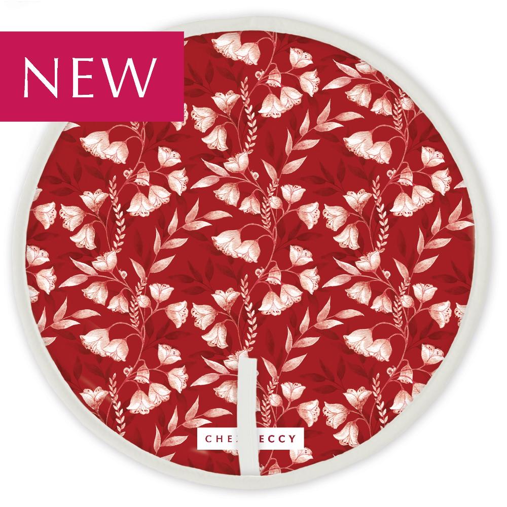 Red circular hob top with white floral design