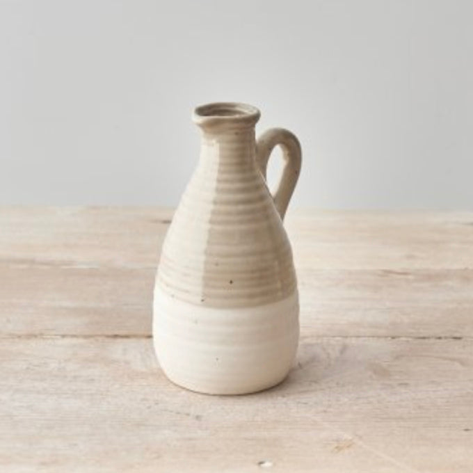 Chic two-tone ceramic jug with a natural beige and white finish, featuring a delicate handle and subtle speckled texture. Perfect for dried flowers, fresh stems, or as a rustic home décor piece. A great gift for Mother's Day or housewarming.