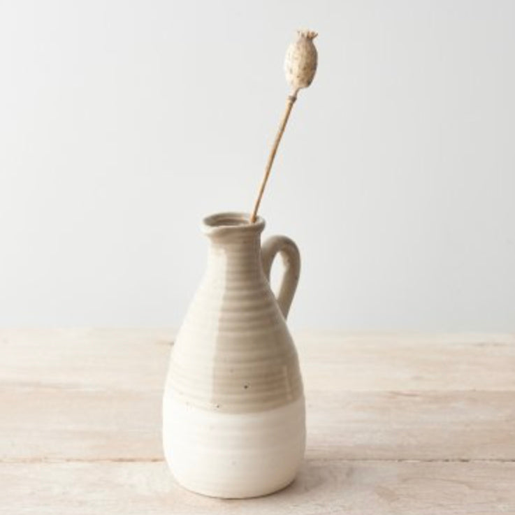 Chic two-tone ceramic jug with a natural beige and white finish, featuring a delicate handle and subtle speckled texture. Perfect for dried flowers, fresh stems, or as a rustic home décor piece. A great gift for Mother's Day or housewarming.