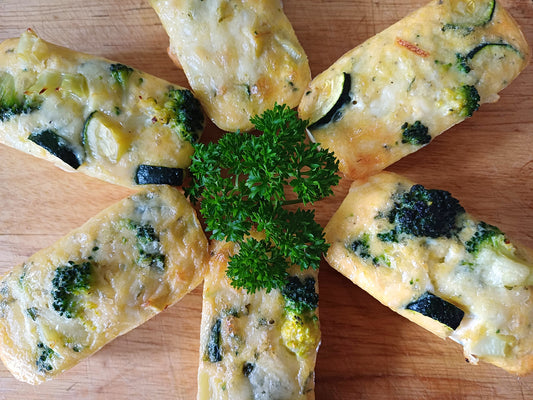 Courgette and broccoli frittata on a board