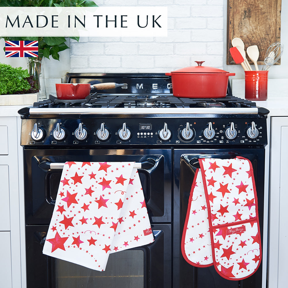 Red stars tea towel and double oven glove on a range cooker