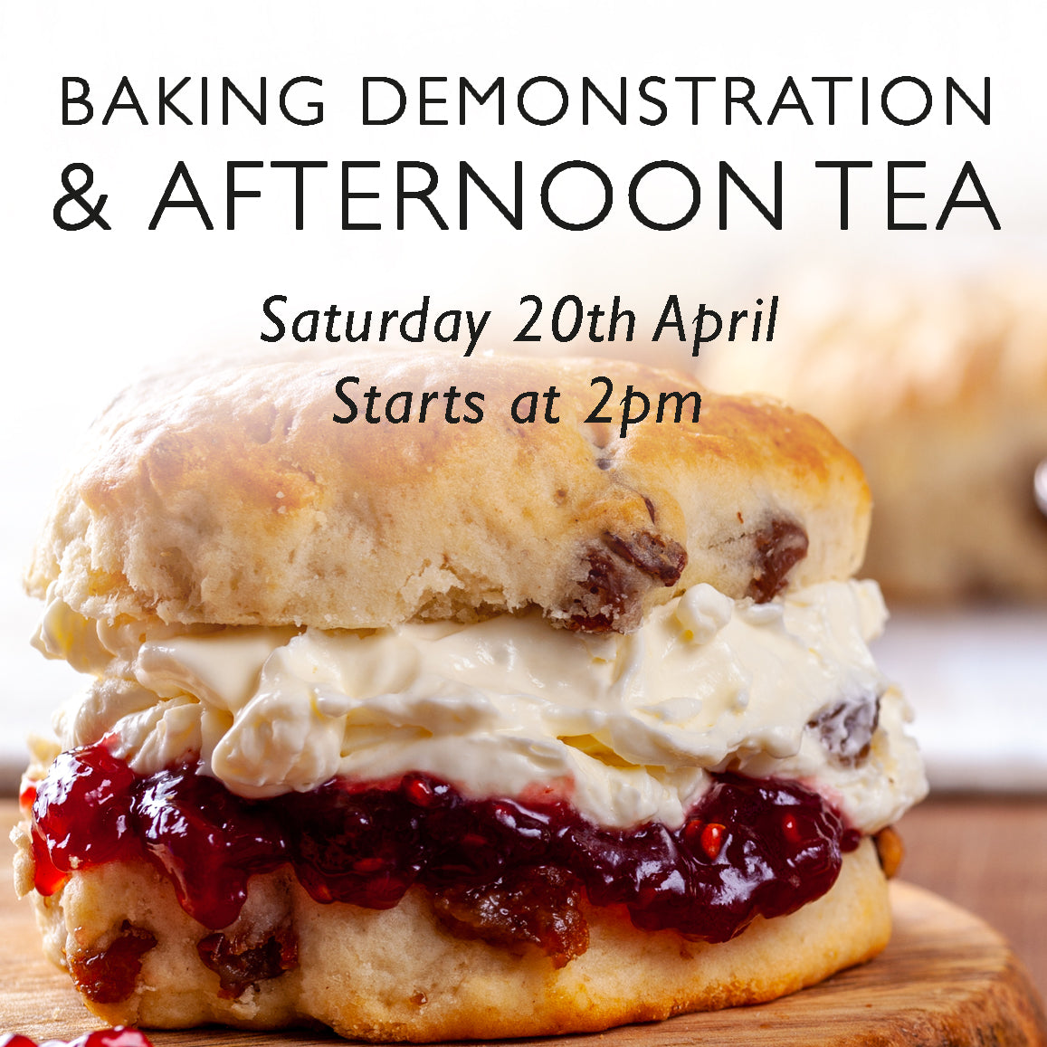 A scone full of jam and cream advertising a baking and afternoon tea demonstration