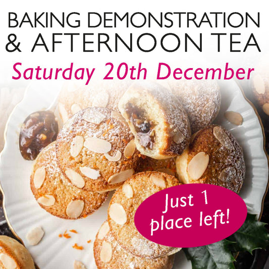 A promotional image for a baking demonstration and afternoon tea event on Saturday, 13th December. The image features delicious mince pies, topped with frangipane. The text is styled in a mix of elegant black and festive pink fonts. Just 1 place left