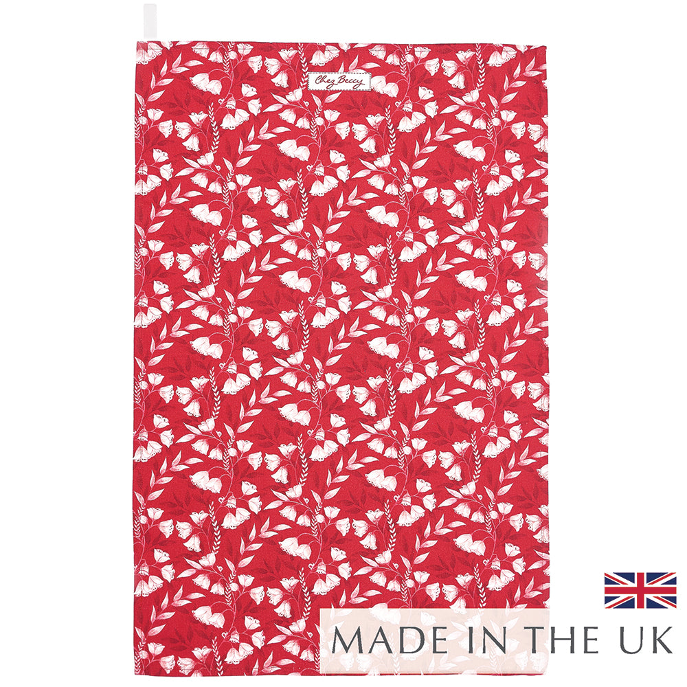 Red cotton tea towel with white floral pattern