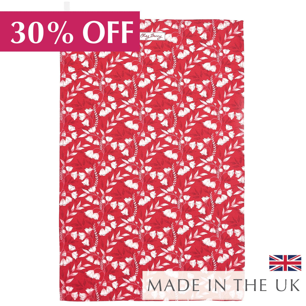 Red cotton tea towel with white floral pattern