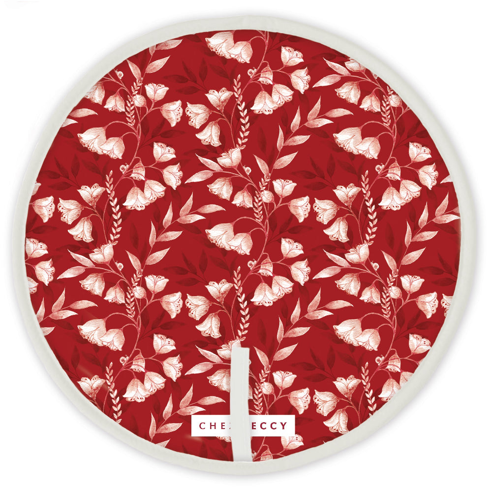 Red circular hob top with white floral design