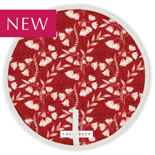 Red circular hob top with white floral design