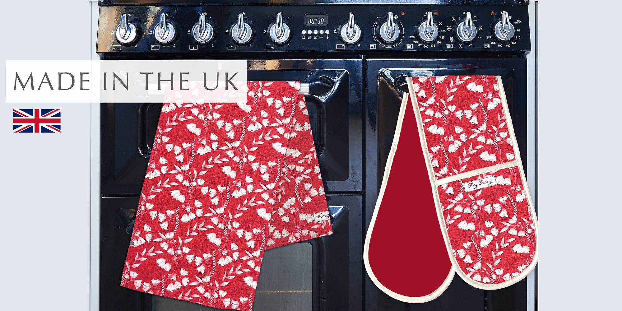 Red Floral Tea towel and double oven glove on a range cooker