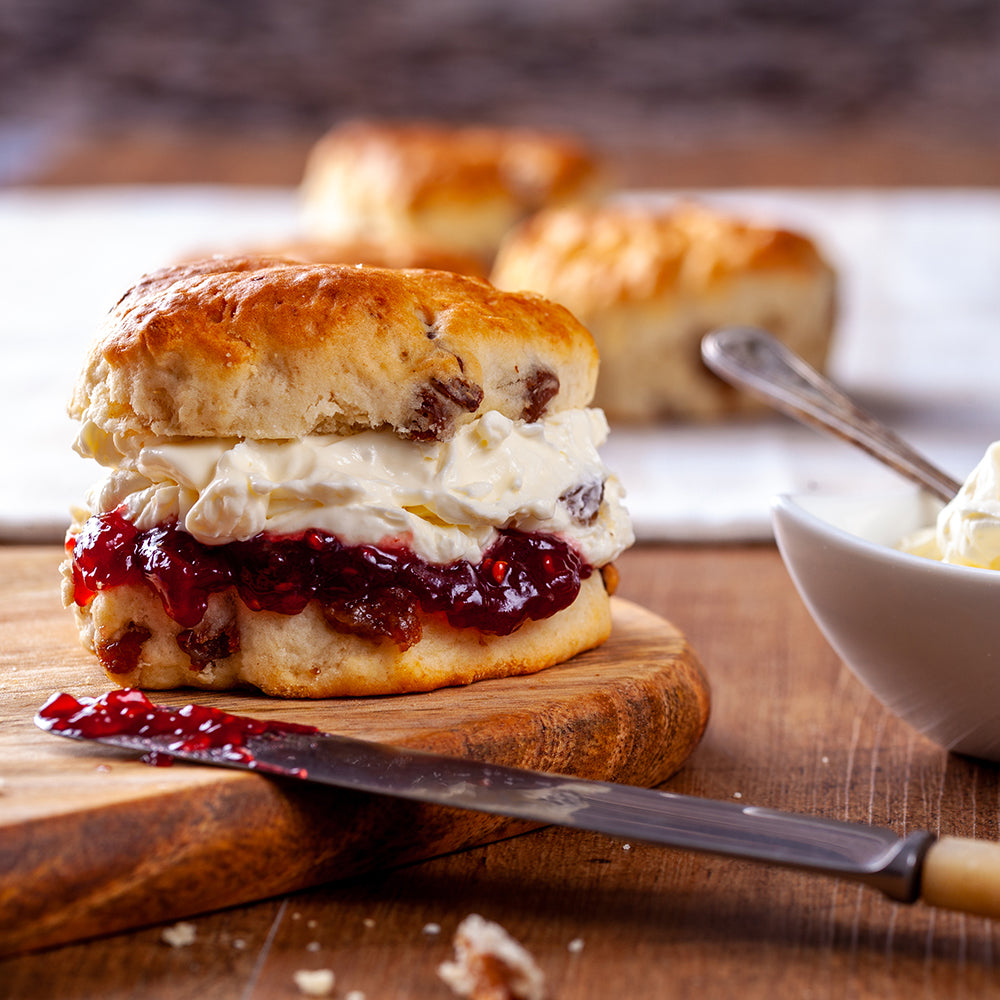 scones layered with jam and cream