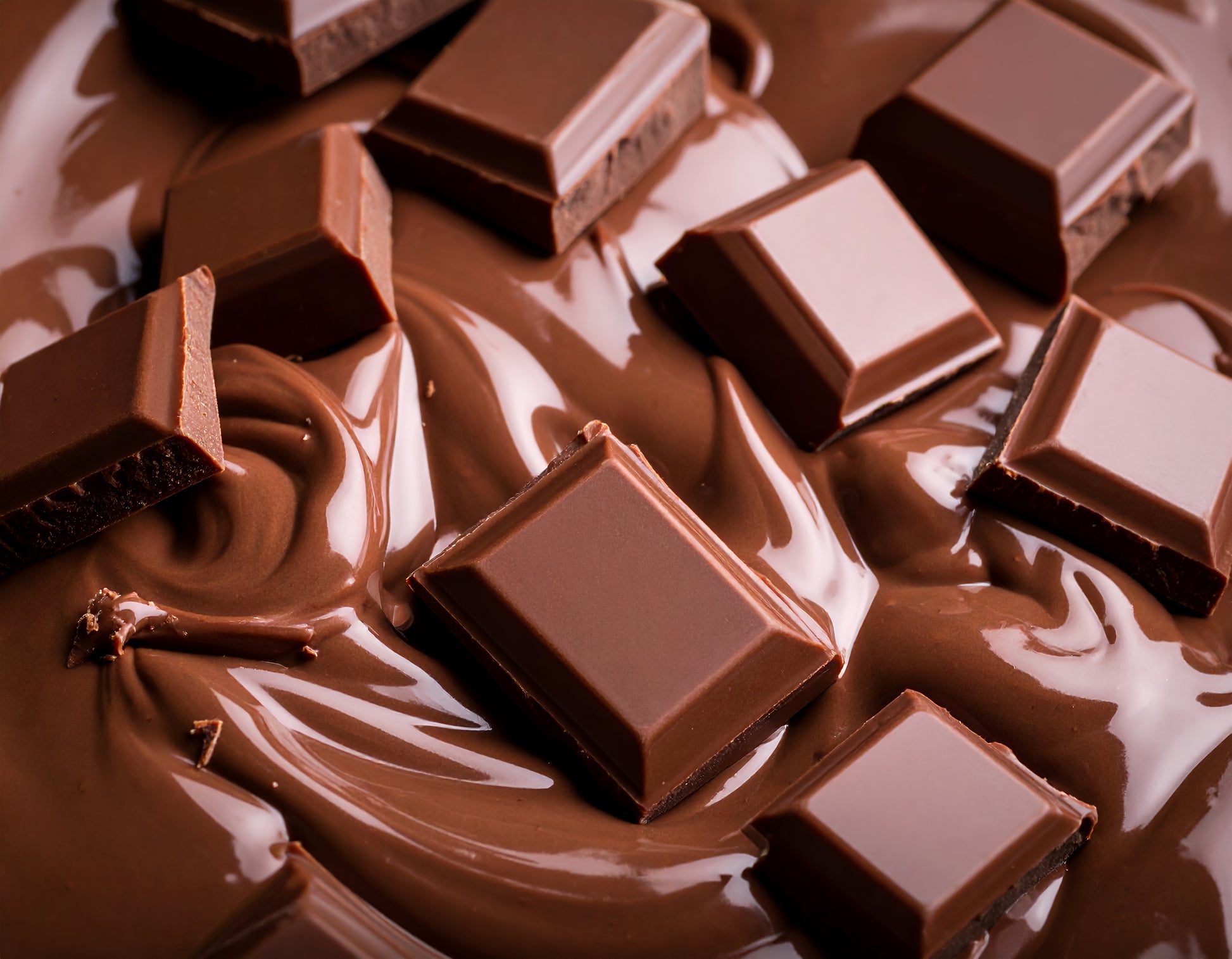 Close-up of tempered dark chocolate pieces used in Chez Beccy chocolate making workshops