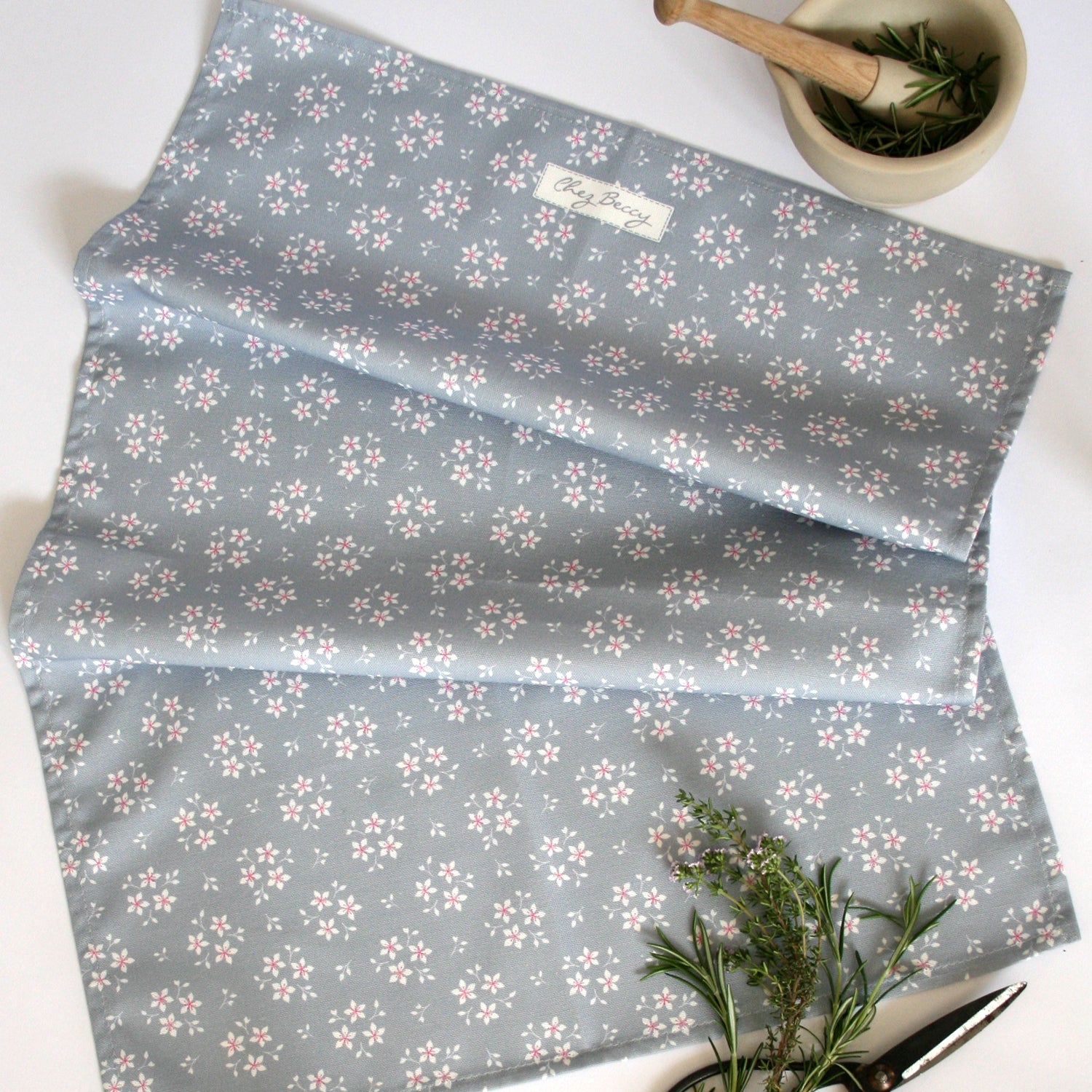 Grey tea towel with little white flowers