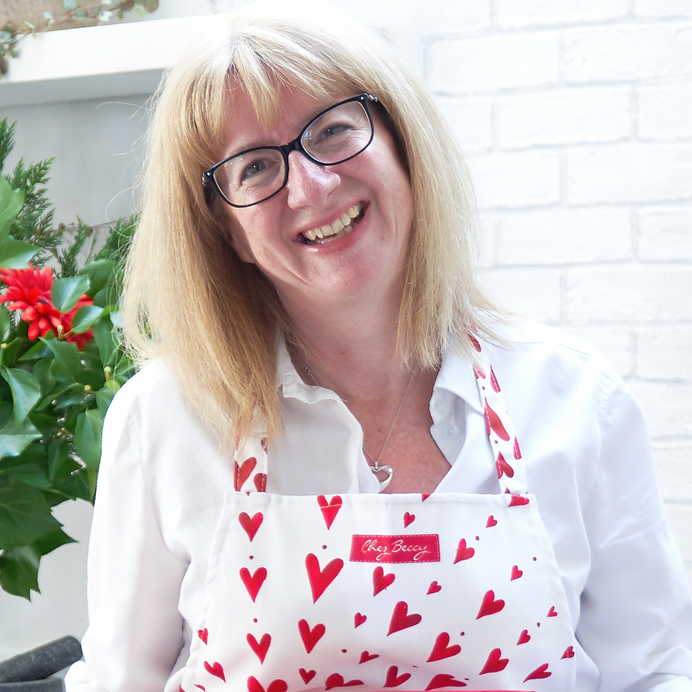 Cook Beccy with red heart apron on